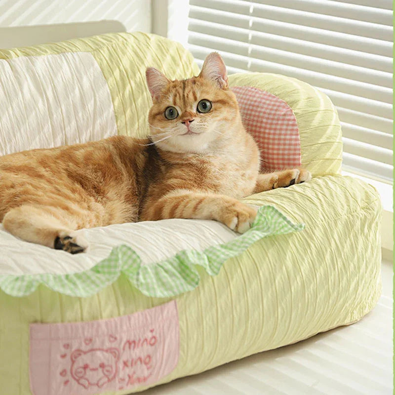 Soft & Cozy Cat Sofas — Perfect Lounging Spots for Happy Indoor Cats with a cat relaxing on a colorful sofa.