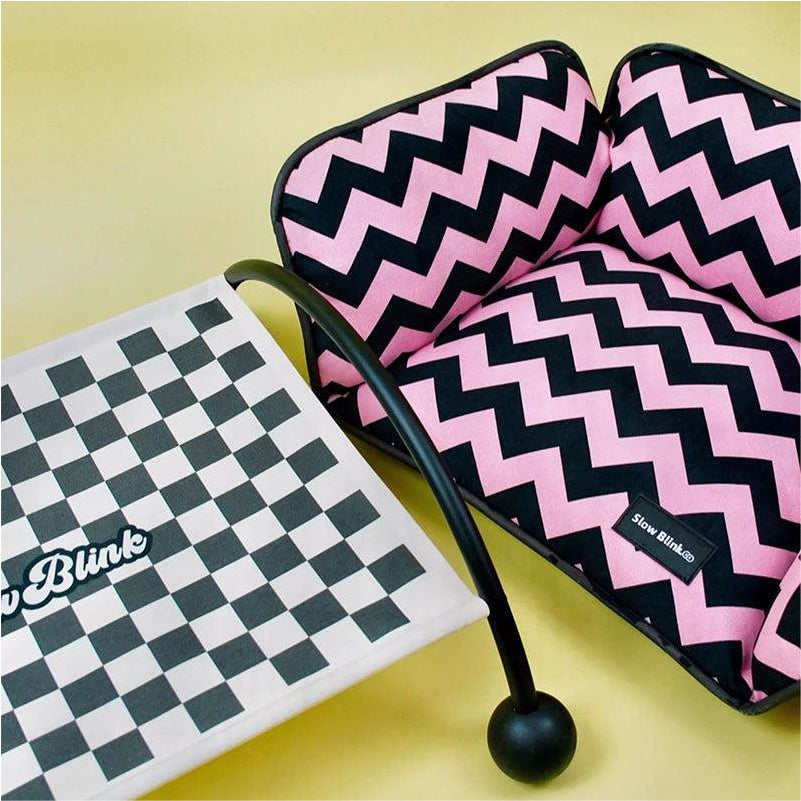 Memphis-Style Elevated Cat Hammock & Woven Wool Cat Cave with pink and black zigzag pattern and checkered base.