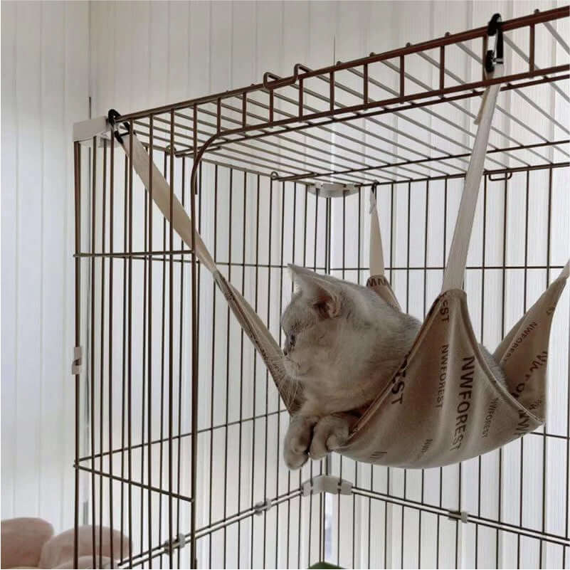 Luxury Space-Themed Cat House — Safe Multi-Level Home for Indoor Cats, cozy cat resting in a hammock inside a modern cat house.