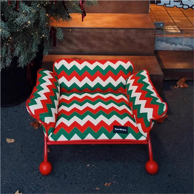 Memphis-Style Elevated Cat Hammock & Woven Wool Cat Cave with festive red, green, and white zigzag pattern.