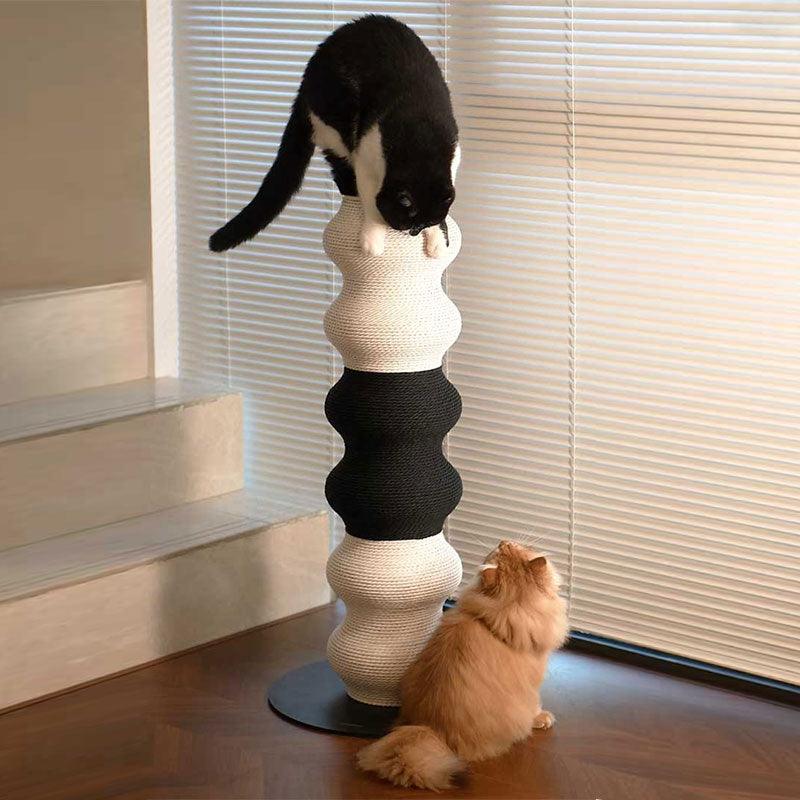 Vertical Large Cat Scratching Post Climbing tree with a black and white cat climbing and an orange cat watching.