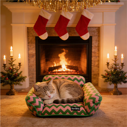 A cozy tabby cat sleeping in a Memphis-Style Elevated Cat Hammock in front of a fireplace during the holidays.