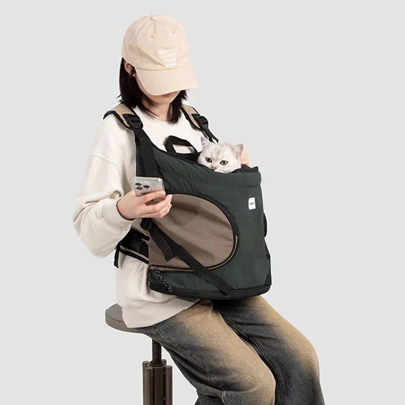 Luxury Cat Carrier Backpack – Breathable Front Pack for Travel & Daily Use with a cat and user on a chair.