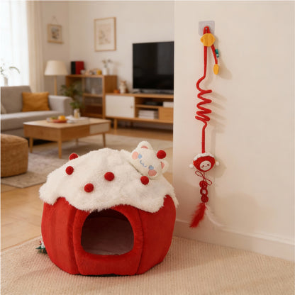 Snowball & Strawberry Cat Cave Bed — Soft & Cozy in a living room setting with a playful plush toy.