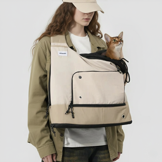 KtKitty Front Cat Carrier Backpack for large cats, featuring a breathable and lightweight design. Shown on a Caucasian model with wavy hair against a realistic white studio wall, highlighting the authentic fabric texture and secure pet positioning.