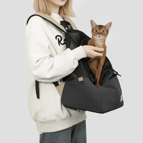 KtKitty Lightweight Cat Carrier Backpack and Front Pack for Small Pets, featuring a Caucasian model in a realistic white wall studio setting. High-resolution shot displaying authentic fabric textures and a comfortable pet carrying experience for hiking and travel.