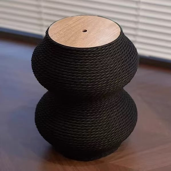 Stylish black rope cat scratching post with wooden top, ideal for encouraging healthy scratching behavior.