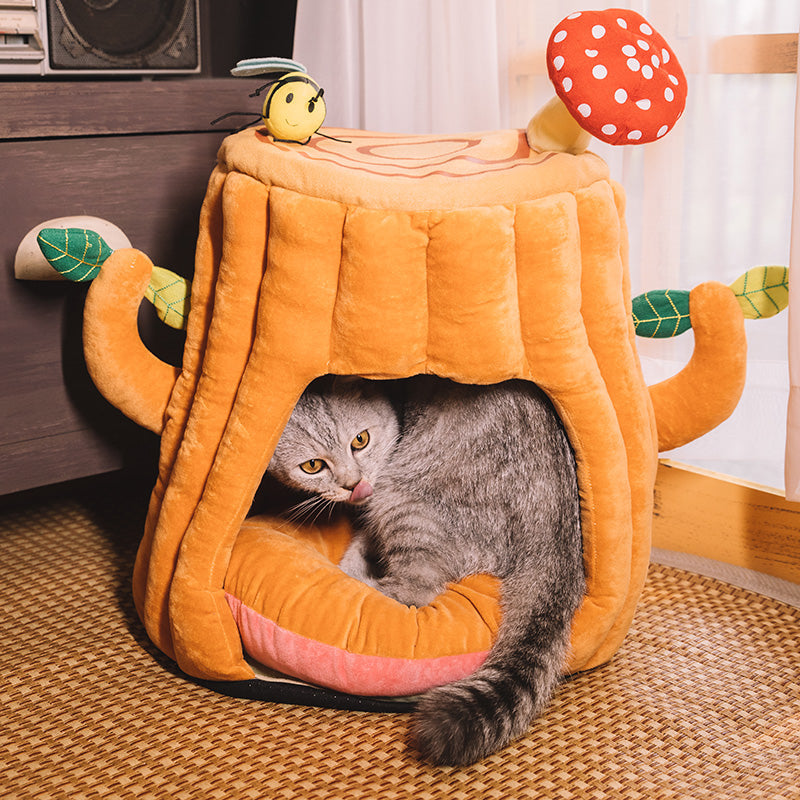 Two cats resting in cozy tree hole pet shelter - KtKitty