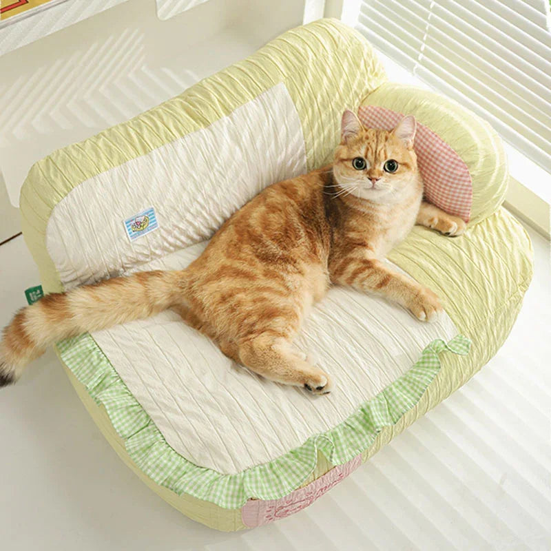 Soft & Cozy Cat Sofas — Perfect Lounging Spots for Happy Indoor Cats with an orange tabby lounging comfortably.