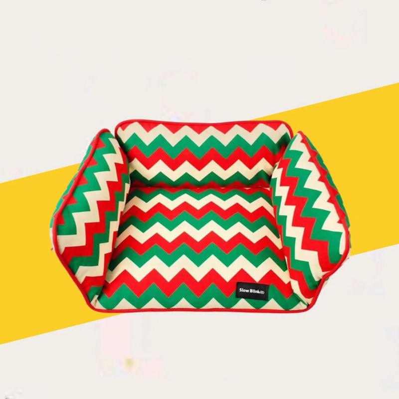 Memphis-Style Elevated Cat Hammock & Woven Wool Cat Cave with a zigzag pattern in green, red, and cream colors.