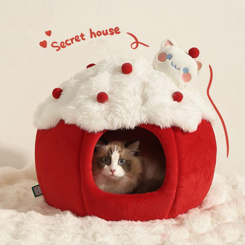 Snowball & Strawberry Cat Cave Bed — Soft & Cozy with a cat inside a cozy red cave resembling a strawberry.