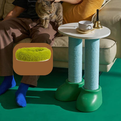 Cat Scratching Climbing Tree with Cozy Rest Platform beside person sitting on sofa with cozy cat bed and coffee cup on table.