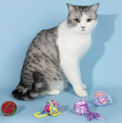 Kittens enjoying the bell sound and yarn ball play.