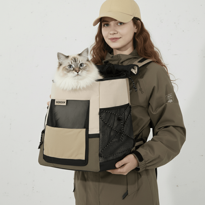 KtKitty Portable Cat Backpack for Front & Back Carry, featuring a smiling Caucasian woman with long wavy hair in a professional white wall setting. This high-resolution photo highlights the ergonomic design, mesh pockets, and durable fabric with a real cat inside for an authentic travel experience.