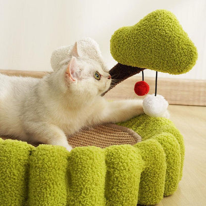 Cozy cat sleeping in a Solid Wood Rattan Cat Tree Tower, using scratching post with a soft, green bed.