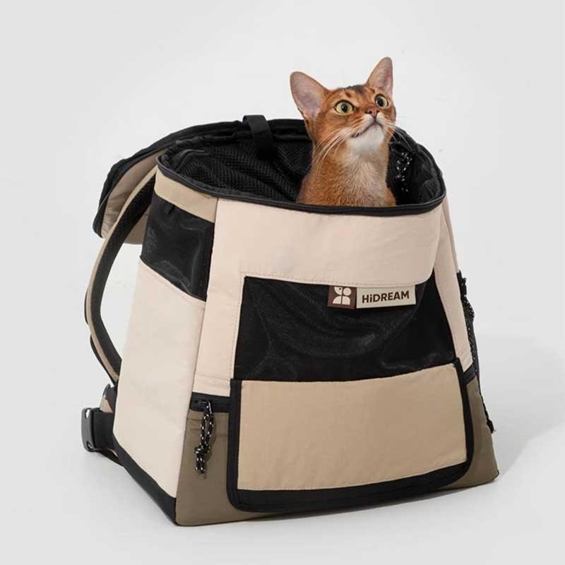 Portable Cat Backpack – Front & Back Carry with a curious cat peeking out from the top.