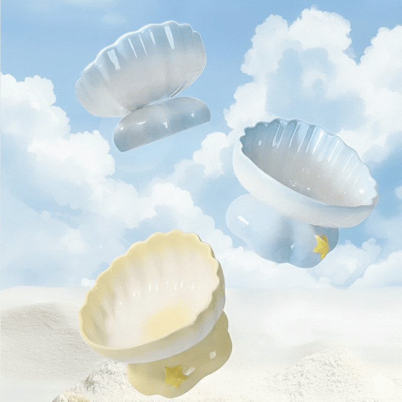 KtKitty Shell-shaped Ceramic Elevated Cat Bowl set in soft blue and pink.