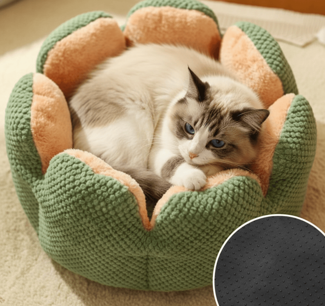A cozy snuggle cat bed with raised bolstered edges for anxiety relief and a secure anti-slip base on a wooden floor.