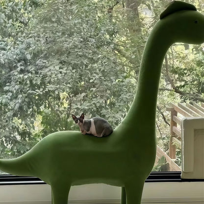 Cushioned landing pad on dinosaur cat tree for post-play rest