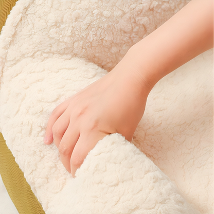 Hand touching plush surface of cozy cat couch - KtKitty