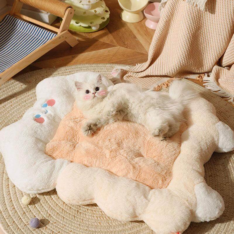 A small kitten sleeping peacefully in an ultra-soft plush kitten sleeping bed, featuring faux fur texture that mimics a mother cat's warmth for anti-anxiety comfort.