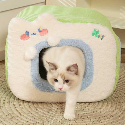 Warm Two-Color Cat Bed Cave – Cozy & Safe Hideaway for Your Cat with a playful cat exploring its entrance.
