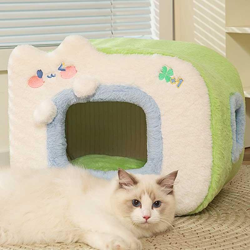 Warm Two-Color Cat Bed Cave – Cozy & Safe Hideaway for Your Cat with a fluffy white cat resting beside it.
